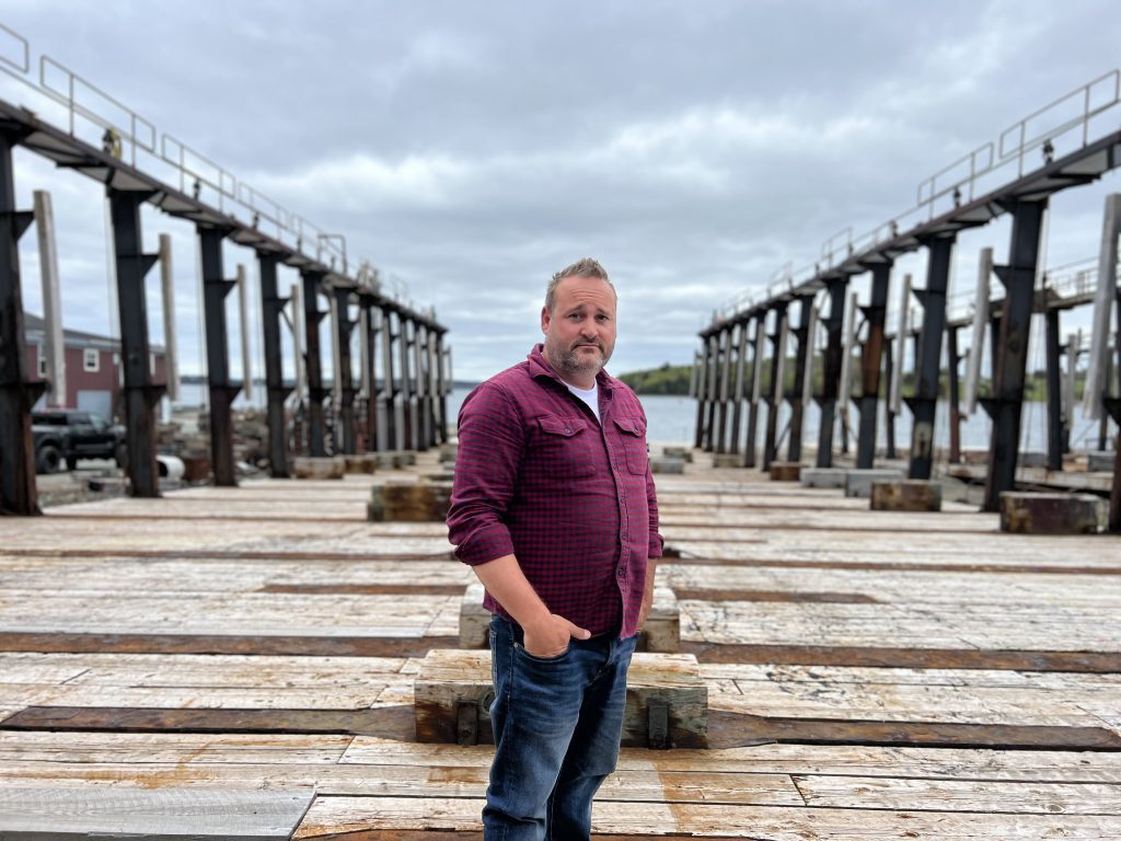 CEO Brad Boutilier inspecting newly installed Marine Railway in Lunenburg Shipyard, Nova Scotia, Canada